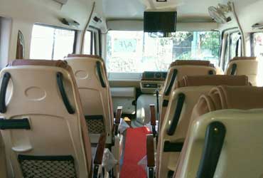 9 seater deluxe 1x1 tempo traveller